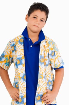 Portrait of a boy standing with arms akimbo