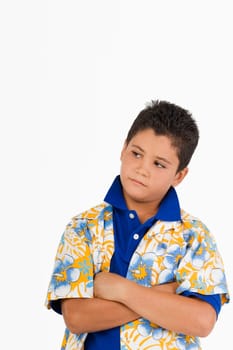 Close-up of a boy standing with his arms crossed