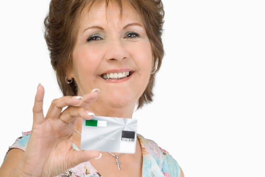 Portrait of a senior woman showing a credit card and smiling