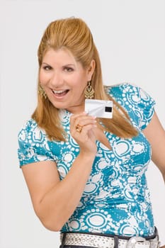 Portrait of a mature woman showing a credit card and smiling