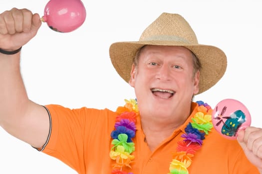 Portrait of a mature man holding maracas