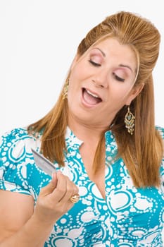 Close-up of a mature woman looking at a credit card