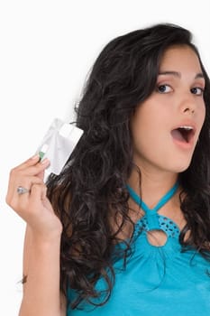 Portrait of a teenage girl holding a credit card