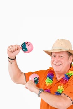 Portrait of a mature man playing maracas and smiling
