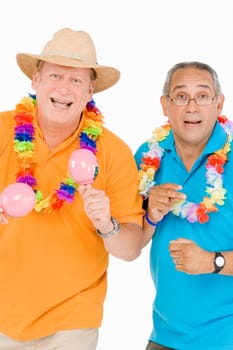 Portrait of a mature man playing maracas with another mature man snapping