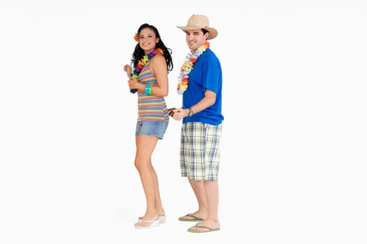 Side profile of a young couple standing and smiling