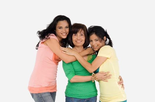 Portrait of a senior woman with her two daughters smiling
