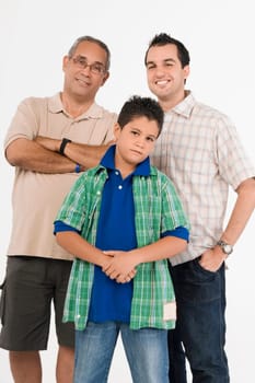 Portrait of a boy standing with his father and grandfather