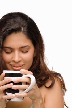 Close-up of a young woman holding a mug of coffee