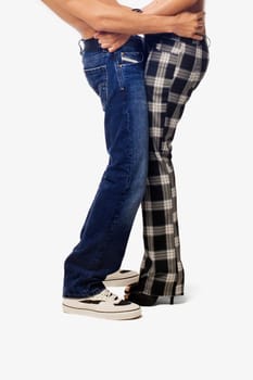 Mid section view of a young couple standing together
