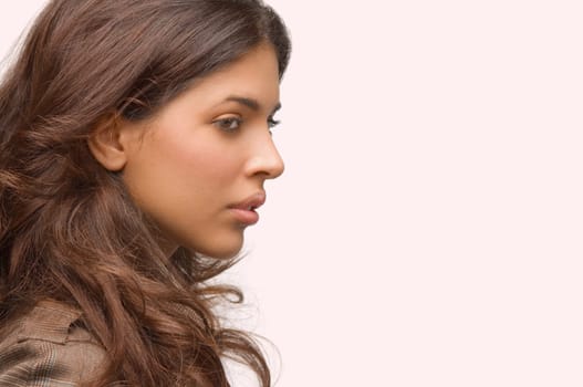 Side profile of a young woman thinking