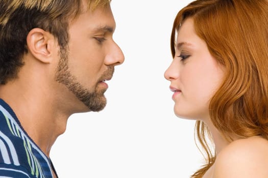 Side profile of a couple looking at each other