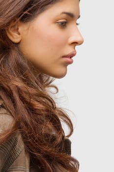 Side profile of a young woman thinking