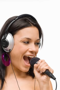 Close-up of a young woman singing into a microphone