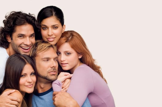 Close-up of a young man smiling with his friends