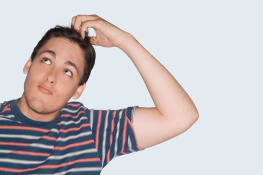 Close-up of a young man looking up
