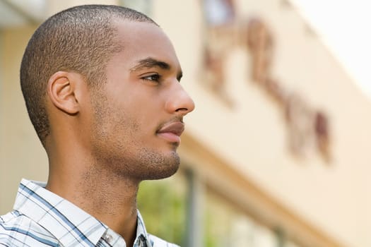 Side profile of a young man looking away