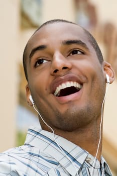 Close-up of a young man listening to music