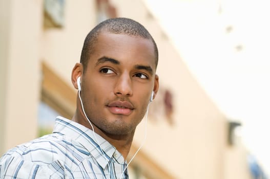 Close-up of a young man listening to music