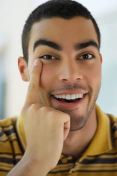 Portrait of a young man pointing his eye
