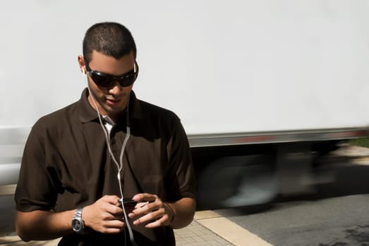 Young man listening to an MP3 player