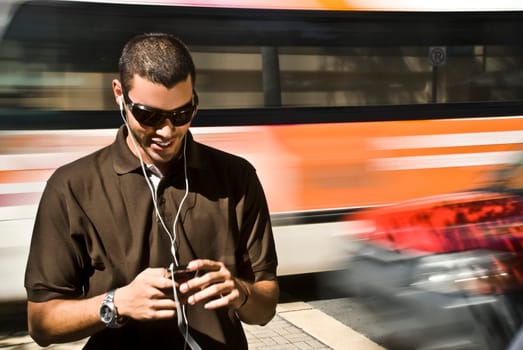 Young man listening to an MP3 player