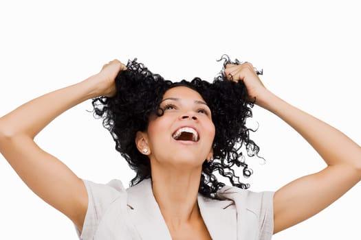 Close-up of a young woman holding her hair