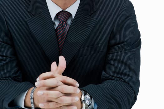 Mid section view of a businessman with his hands clasped