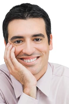 Portrait of a businessman smiling with his hand on his chin