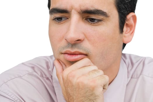 Close-up of a businessman thinking with his hand on his chin