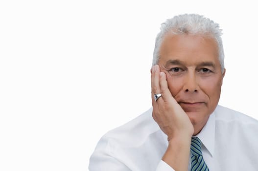 Portrait of a senior man thinking with his hand on his chin