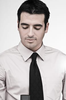 Close-up of a businessman looking at a mobile phone
