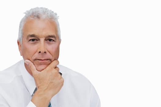 Portrait of a businessman thinking with his hand on his chin