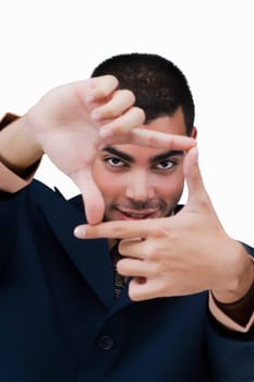 Portrait of a businessman making a finger frame