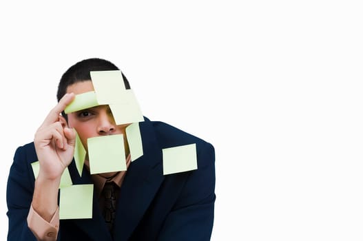 Portrait of a businessman covered with adhesive notes