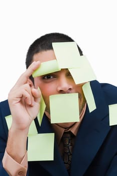 Portrait of a businessman covered with adhesive notes