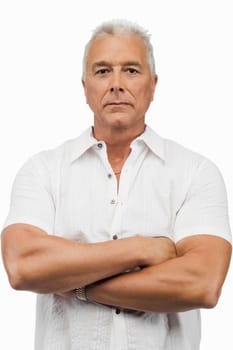 Portrait of a senior man standing with his arms crossed