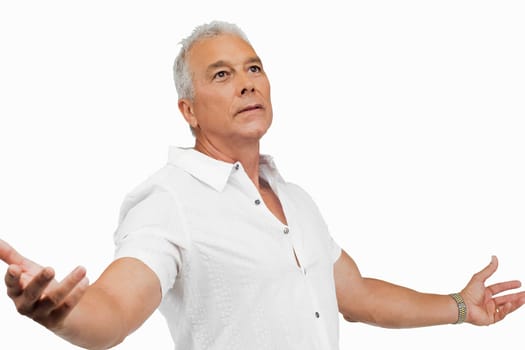 Close-up of a senior man standing with his arms outstretched