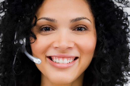 Close-up of a female customer service representative wearing a headset