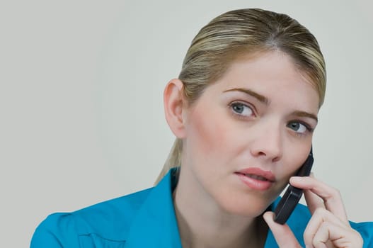 Close-up of a young woman talking on a mobile phone