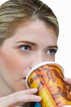 Close-up of a young woman drinking coffee