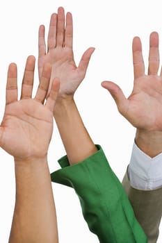 Close-up of business executives raising their hands