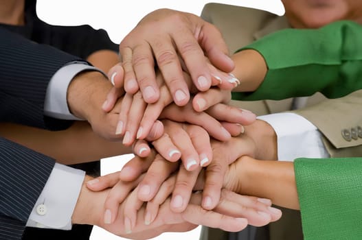 Close-up of business executives stacking hands