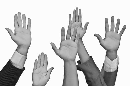 Close-up of business executives raising their hands