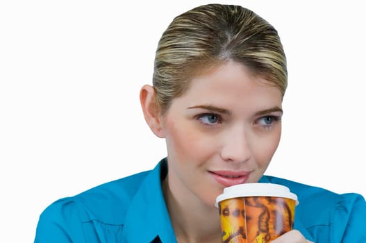Close-up of a young woman holding a cup of coffee