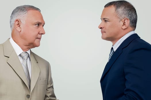 Two businessmen looking at each other