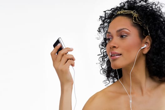 Close-up of a young woman listening to an MP3 player