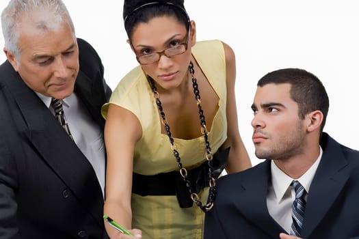 Two businessmen and a businesswoman discussing