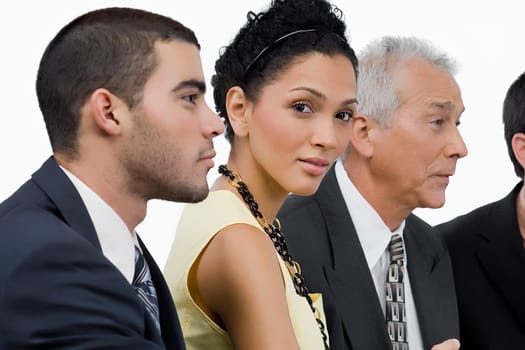 Three businessmen and a businesswoman at a meeting in a conference room