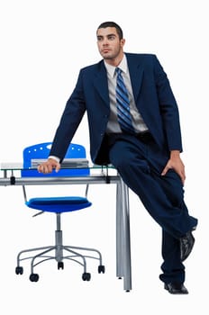 Businessman sitting at a desk and thinking